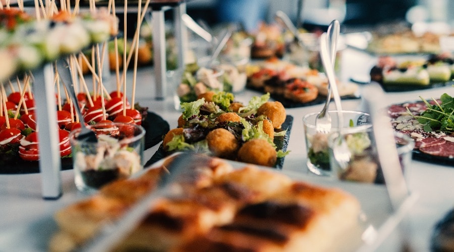 Table full of tasty food beautifully decorated.